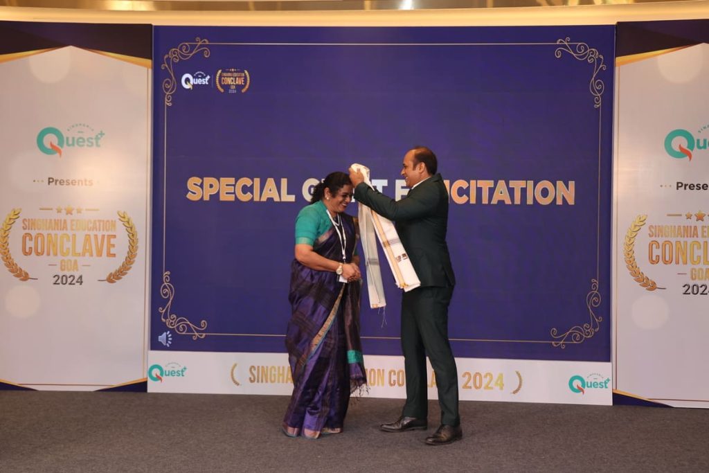 Principal receiving recognition at Conclave